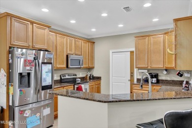 a beautifully maintained and thoughtfully upgraded 4-bedroom on Diamondhead Country Club in Mississippi - for sale on GolfHomes.com, golf home, golf lot