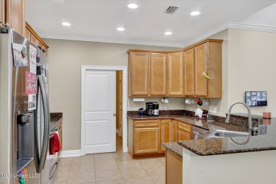 a beautifully maintained and thoughtfully upgraded 4-bedroom on Diamondhead Country Club in Mississippi - for sale on GolfHomes.com, golf home, golf lot
