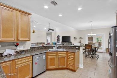 a beautifully maintained and thoughtfully upgraded 4-bedroom on Diamondhead Country Club in Mississippi - for sale on GolfHomes.com, golf home, golf lot
