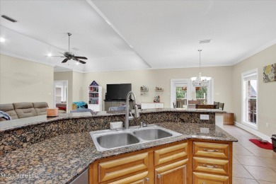 a beautifully maintained and thoughtfully upgraded 4-bedroom on Diamondhead Country Club in Mississippi - for sale on GolfHomes.com, golf home, golf lot