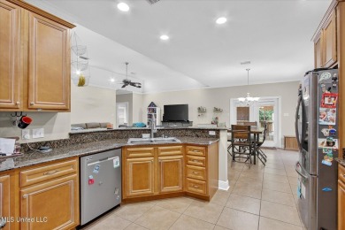 a beautifully maintained and thoughtfully upgraded 4-bedroom on Diamondhead Country Club in Mississippi - for sale on GolfHomes.com, golf home, golf lot
