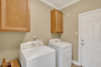 a beautifully maintained and thoughtfully upgraded 4-bedroom on Diamondhead Country Club in Mississippi - for sale on GolfHomes.com, golf home, golf lot