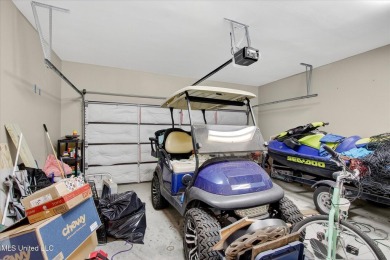 a beautifully maintained and thoughtfully upgraded 4-bedroom on Diamondhead Country Club in Mississippi - for sale on GolfHomes.com, golf home, golf lot