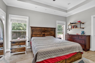 a beautifully maintained and thoughtfully upgraded 4-bedroom on Diamondhead Country Club in Mississippi - for sale on GolfHomes.com, golf home, golf lot