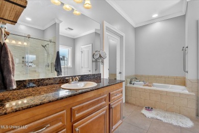 a beautifully maintained and thoughtfully upgraded 4-bedroom on Diamondhead Country Club in Mississippi - for sale on GolfHomes.com, golf home, golf lot