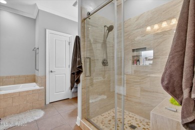 a beautifully maintained and thoughtfully upgraded 4-bedroom on Diamondhead Country Club in Mississippi - for sale on GolfHomes.com, golf home, golf lot