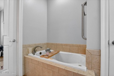 a beautifully maintained and thoughtfully upgraded 4-bedroom on Diamondhead Country Club in Mississippi - for sale on GolfHomes.com, golf home, golf lot
