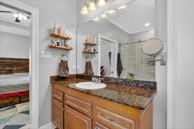 a beautifully maintained and thoughtfully upgraded 4-bedroom on Diamondhead Country Club in Mississippi - for sale on GolfHomes.com, golf home, golf lot