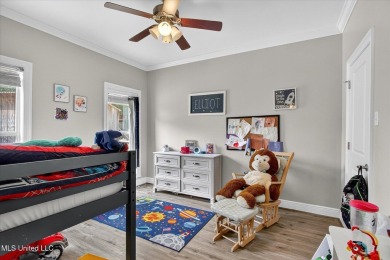 a beautifully maintained and thoughtfully upgraded 4-bedroom on Diamondhead Country Club in Mississippi - for sale on GolfHomes.com, golf home, golf lot