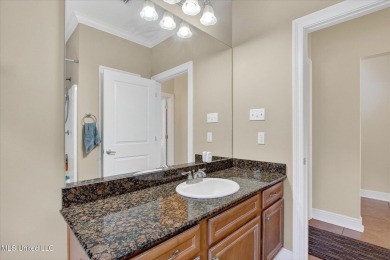a beautifully maintained and thoughtfully upgraded 4-bedroom on Diamondhead Country Club in Mississippi - for sale on GolfHomes.com, golf home, golf lot
