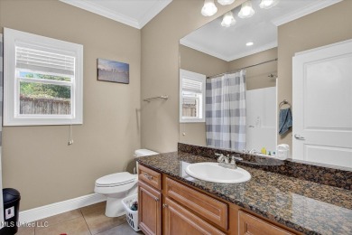 a beautifully maintained and thoughtfully upgraded 4-bedroom on Diamondhead Country Club in Mississippi - for sale on GolfHomes.com, golf home, golf lot