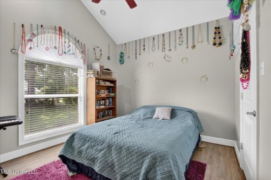 a beautifully maintained and thoughtfully upgraded 4-bedroom on Diamondhead Country Club in Mississippi - for sale on GolfHomes.com, golf home, golf lot