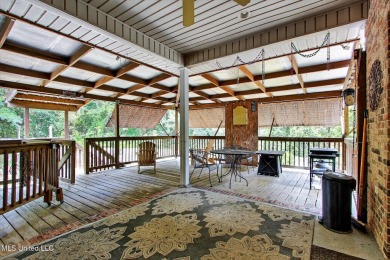 a beautifully maintained and thoughtfully upgraded 4-bedroom on Diamondhead Country Club in Mississippi - for sale on GolfHomes.com, golf home, golf lot
