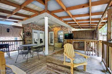 a beautifully maintained and thoughtfully upgraded 4-bedroom on Diamondhead Country Club in Mississippi - for sale on GolfHomes.com, golf home, golf lot