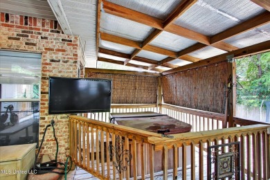 a beautifully maintained and thoughtfully upgraded 4-bedroom on Diamondhead Country Club in Mississippi - for sale on GolfHomes.com, golf home, golf lot