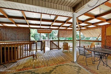 a beautifully maintained and thoughtfully upgraded 4-bedroom on Diamondhead Country Club in Mississippi - for sale on GolfHomes.com, golf home, golf lot