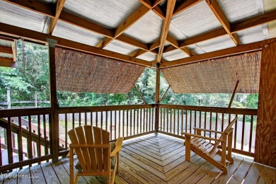 a beautifully maintained and thoughtfully upgraded 4-bedroom on Diamondhead Country Club in Mississippi - for sale on GolfHomes.com, golf home, golf lot