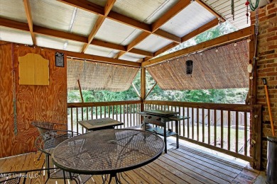 a beautifully maintained and thoughtfully upgraded 4-bedroom on Diamondhead Country Club in Mississippi - for sale on GolfHomes.com, golf home, golf lot