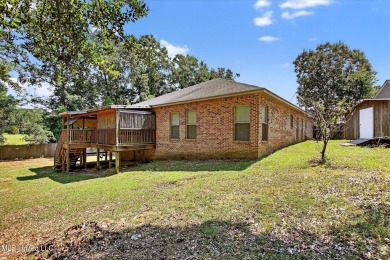 a beautifully maintained and thoughtfully upgraded 4-bedroom on Diamondhead Country Club in Mississippi - for sale on GolfHomes.com, golf home, golf lot