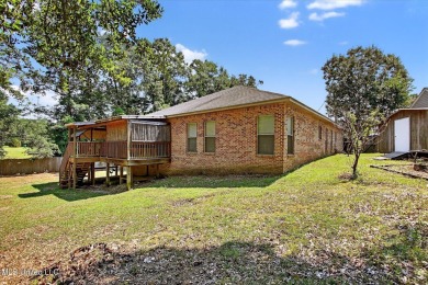 a beautifully maintained and thoughtfully upgraded 4-bedroom on Diamondhead Country Club in Mississippi - for sale on GolfHomes.com, golf home, golf lot
