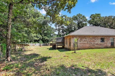 a beautifully maintained and thoughtfully upgraded 4-bedroom on Diamondhead Country Club in Mississippi - for sale on GolfHomes.com, golf home, golf lot