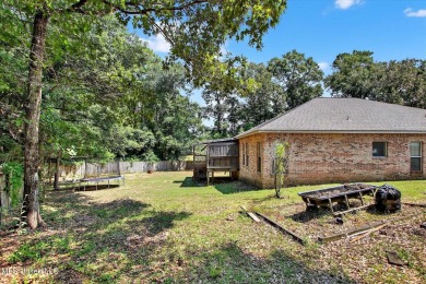 a beautifully maintained and thoughtfully upgraded 4-bedroom on Diamondhead Country Club in Mississippi - for sale on GolfHomes.com, golf home, golf lot