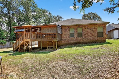 a beautifully maintained and thoughtfully upgraded 4-bedroom on Diamondhead Country Club in Mississippi - for sale on GolfHomes.com, golf home, golf lot