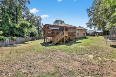 a beautifully maintained and thoughtfully upgraded 4-bedroom on Diamondhead Country Club in Mississippi - for sale on GolfHomes.com, golf home, golf lot