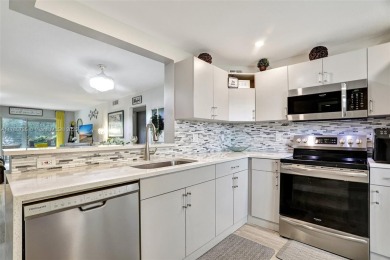 Welcome to this beautifully updated 2-bedroom, 2-bathroom condo on Wynmoor Golf Course in Florida - for sale on GolfHomes.com, golf home, golf lot