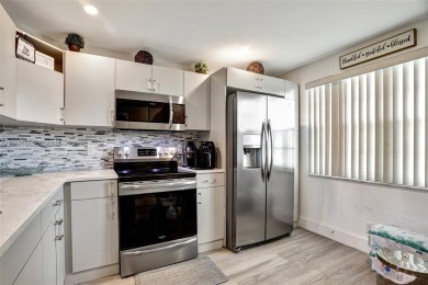 Welcome to this beautifully updated 2-bedroom, 2-bathroom condo on Wynmoor Golf Course in Florida - for sale on GolfHomes.com, golf home, golf lot