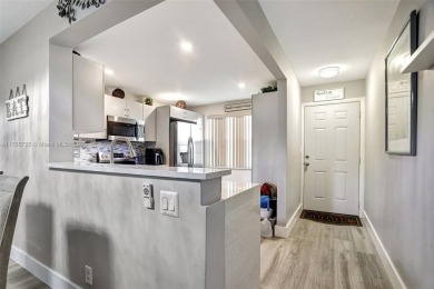 Welcome to this beautifully updated 2-bedroom, 2-bathroom condo on Wynmoor Golf Course in Florida - for sale on GolfHomes.com, golf home, golf lot