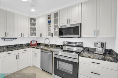 FURNISHED LAKEFRONT CORNER UNIT CONDO in the desirable Cypresses on Boca Lago Golf and Country Club in Florida - for sale on GolfHomes.com, golf home, golf lot