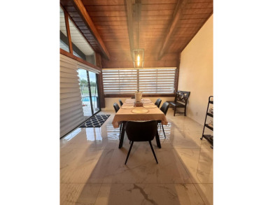 This beautiful modern home has lots of upgrades. It's a true on Ocean Breeze Golf and Country Club in Florida - for sale on GolfHomes.com, golf home, golf lot