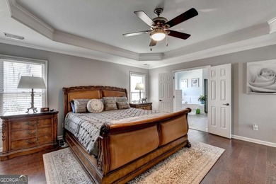 Perfectly positioned on the 8th green in highly desirable on Hampton Golf Village in Georgia - for sale on GolfHomes.com, golf home, golf lot