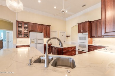 Step into refined living with this spacious executive retreat on Spruce Creek Golf Club in Florida - for sale on GolfHomes.com, golf home, golf lot