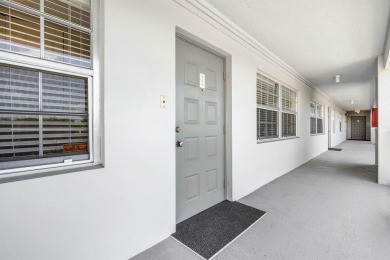 Spacious 3-Bedroom Condo with Stunning Lake, Garden, and Golf on Palm-Aire Country Club and Resort - The Oaks in Florida - for sale on GolfHomes.com, golf home, golf lot