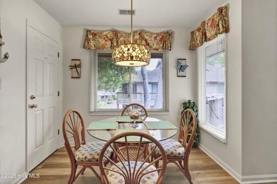 Nestled in the heart of Sunset Beach, this beautifully furnished on Oyster Bay Golf Links in North Carolina - for sale on GolfHomes.com, golf home, golf lot