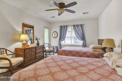 Nestled in the heart of Sunset Beach, this beautifully furnished on Oyster Bay Golf Links in North Carolina - for sale on GolfHomes.com, golf home, golf lot