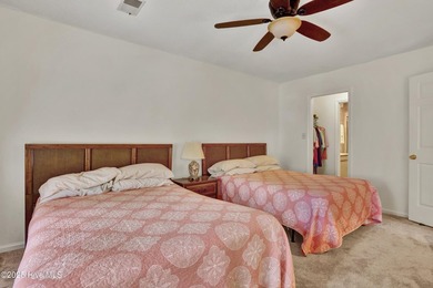 Nestled in the heart of Sunset Beach, this beautifully furnished on Oyster Bay Golf Links in North Carolina - for sale on GolfHomes.com, golf home, golf lot