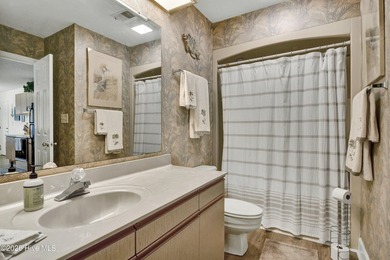 Nestled in the heart of Sunset Beach, this beautifully furnished on Oyster Bay Golf Links in North Carolina - for sale on GolfHomes.com, golf home, golf lot