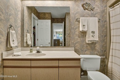 Nestled in the heart of Sunset Beach, this beautifully furnished on Oyster Bay Golf Links in North Carolina - for sale on GolfHomes.com, golf home, golf lot