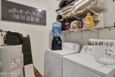 Nestled in the heart of Sunset Beach, this beautifully furnished on Oyster Bay Golf Links in North Carolina - for sale on GolfHomes.com, golf home, golf lot