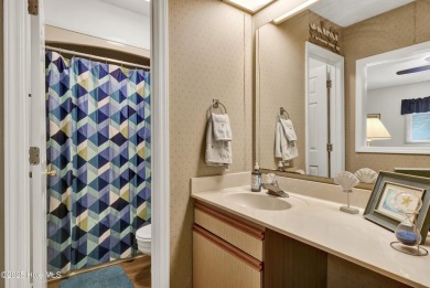 Nestled in the heart of Sunset Beach, this beautifully furnished on Oyster Bay Golf Links in North Carolina - for sale on GolfHomes.com, golf home, golf lot