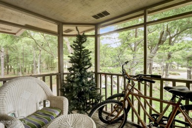 Nestled in the heart of Sunset Beach, this beautifully furnished on Oyster Bay Golf Links in North Carolina - for sale on GolfHomes.com, golf home, golf lot