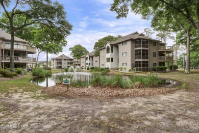 Nestled in the heart of Sunset Beach, this beautifully furnished on Oyster Bay Golf Links in North Carolina - for sale on GolfHomes.com, golf home, golf lot