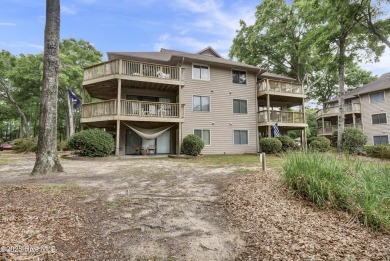 Nestled in the heart of Sunset Beach, this beautifully furnished on Oyster Bay Golf Links in North Carolina - for sale on GolfHomes.com, golf home, golf lot