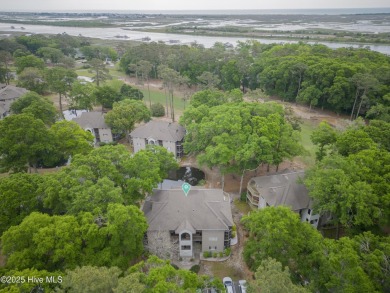 Nestled in the heart of Sunset Beach, this beautifully furnished on Oyster Bay Golf Links in North Carolina - for sale on GolfHomes.com, golf home, golf lot