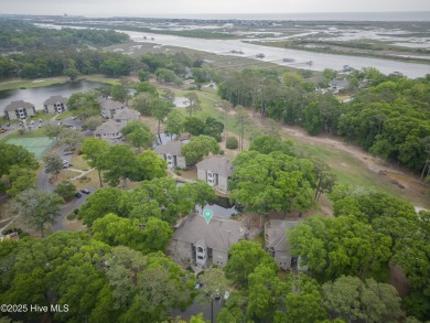 Nestled in the heart of Sunset Beach, this beautifully furnished on Oyster Bay Golf Links in North Carolina - for sale on GolfHomes.com, golf home, golf lot