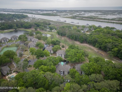 Nestled in the heart of Sunset Beach, this beautifully furnished on Oyster Bay Golf Links in North Carolina - for sale on GolfHomes.com, golf home, golf lot