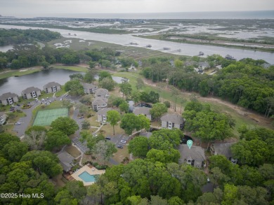 Nestled in the heart of Sunset Beach, this beautifully furnished on Oyster Bay Golf Links in North Carolina - for sale on GolfHomes.com, golf home, golf lot